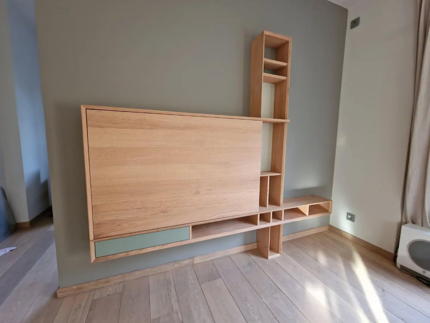 Sliding panel closed in front of the television