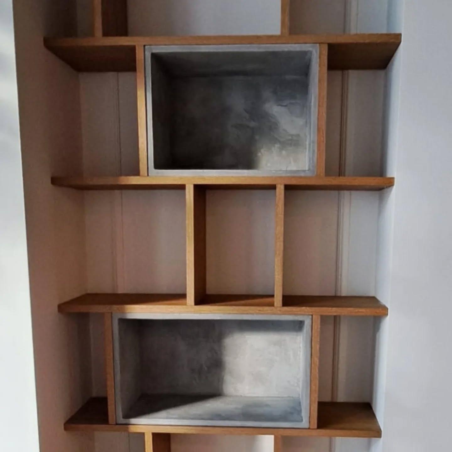 Detail of the microcement boxes and oak shelves